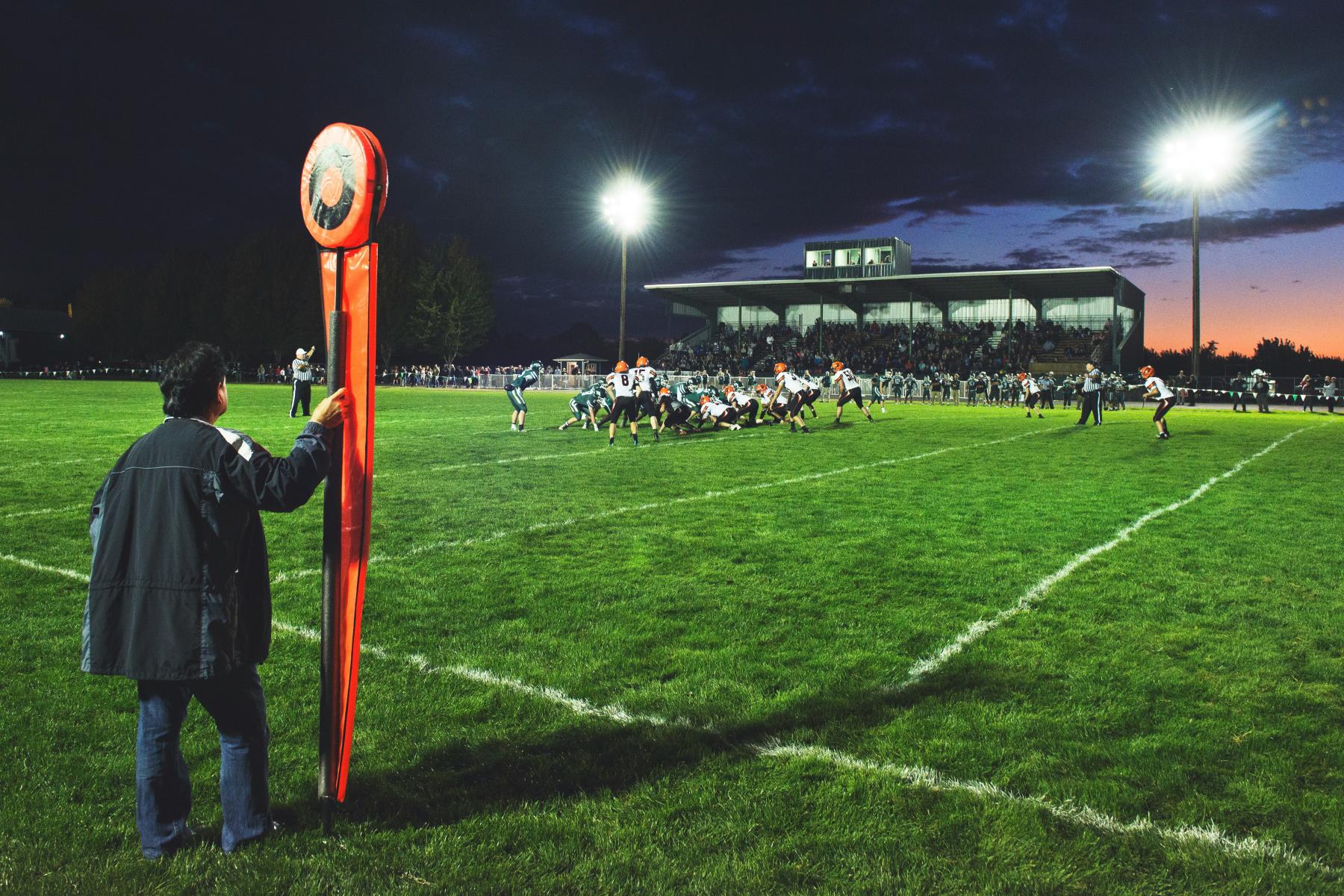 Nighttime footbal game - Tim Mossholder